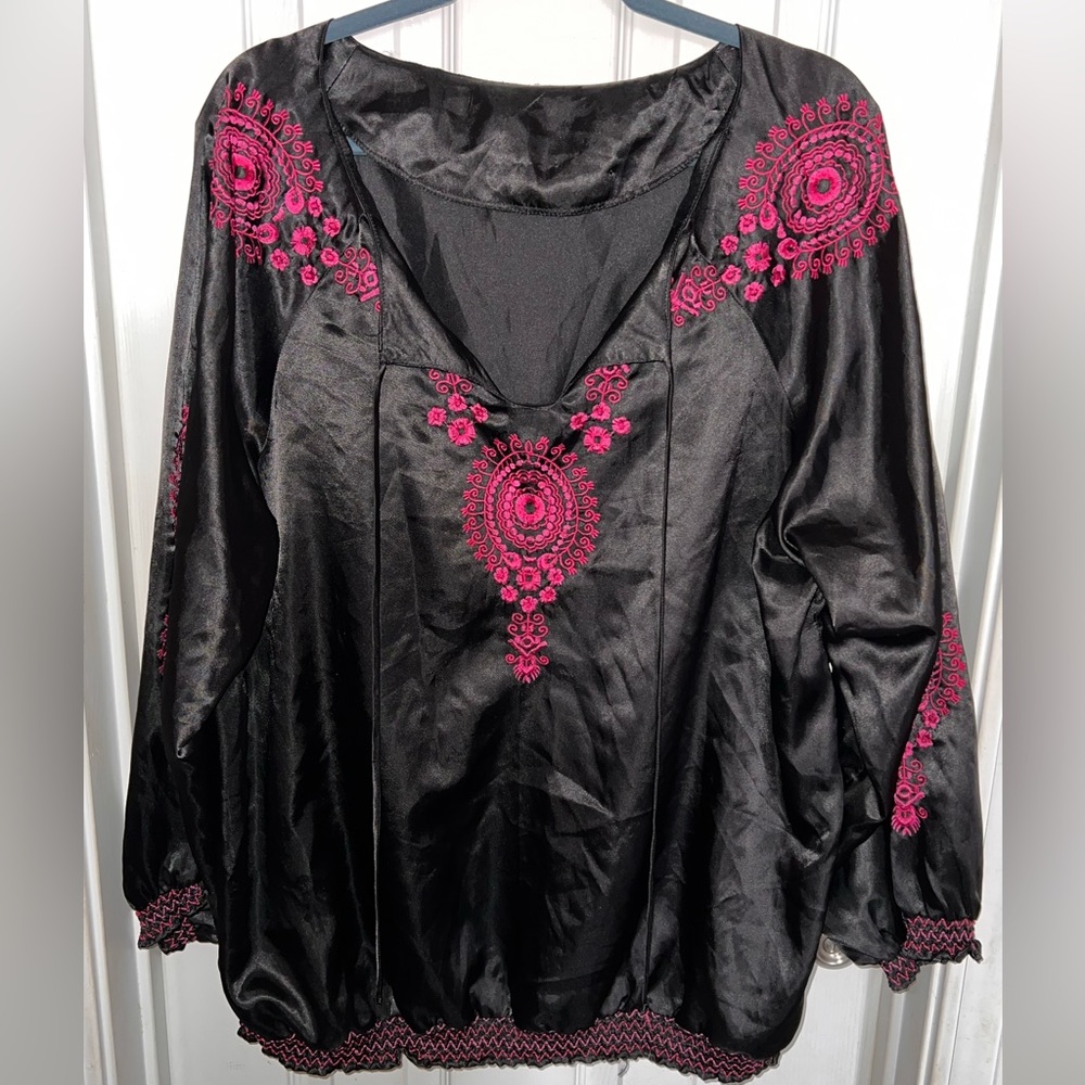 Woman’s black and pink embroidered long sleeve blouse